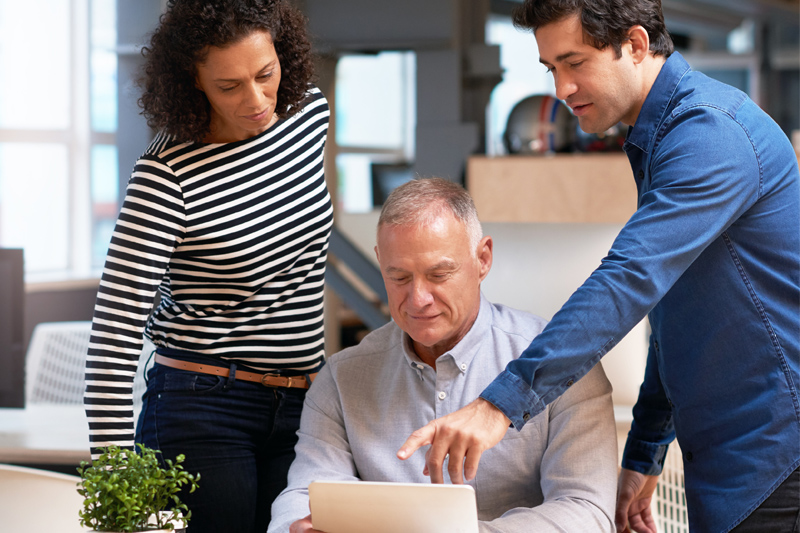 how to avoid online survey fraud, diverse group using laptop