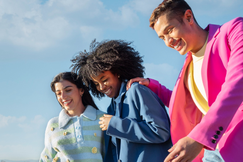 happy young people with a blue sky background